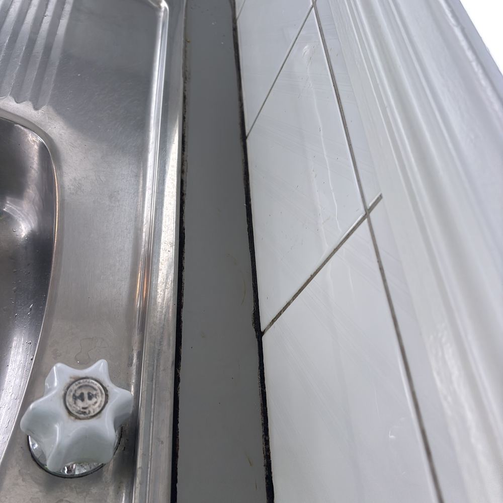 Failed sealant letting moisture behind the benchtop, Braybrook, Manor Lakes