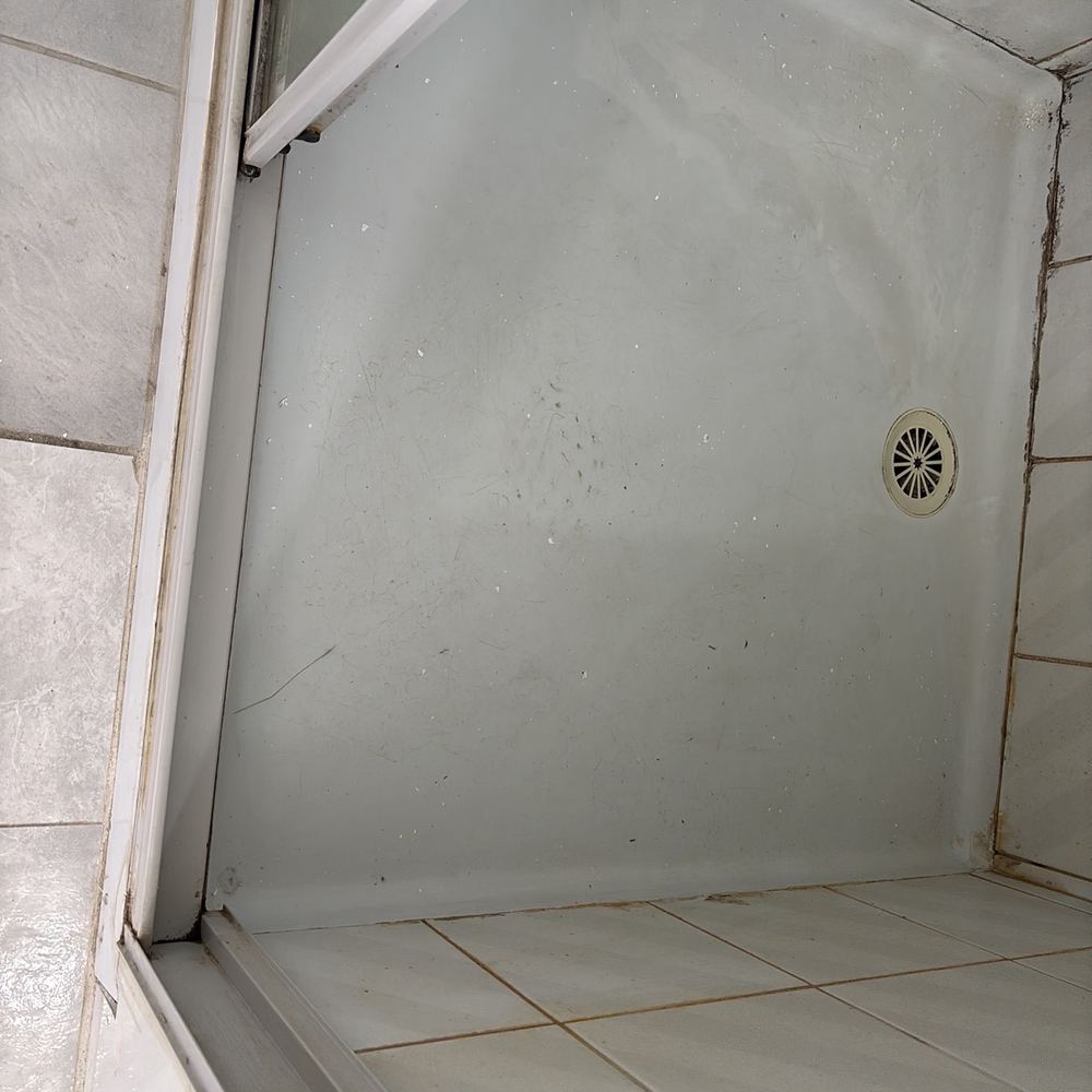 Old shower enclosure worn and deteriorated, found during a pre-purchase inspection in Braybrook