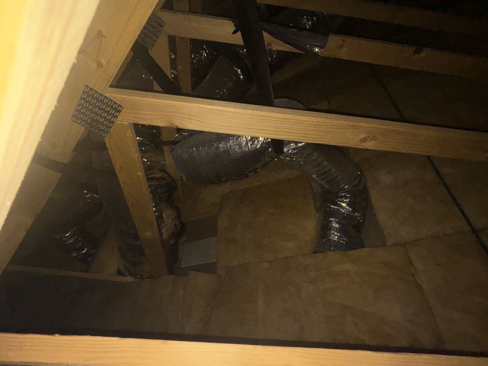 Heating ducts bent tight and crimped in the roof, choking the airflow, found during a lock-up stage inspection in Manor Lakes