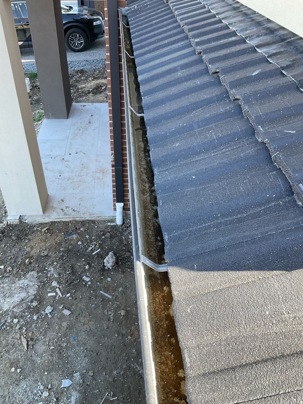 Gutter holding water because its fall is wrong, Manor Lakes
